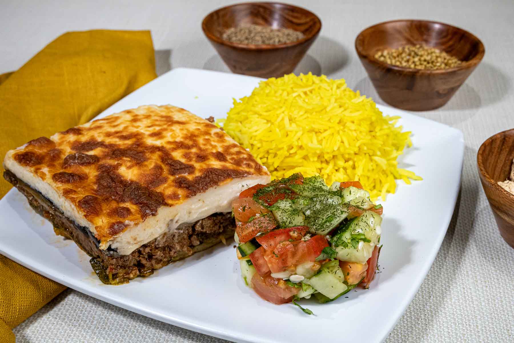 Mussaka, an egglant and potato-based dish layered with ground meat at Cous Cous Cafe